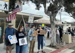 Rally in La Jolla honors late Rep. John Lewis with protest of Trump administration